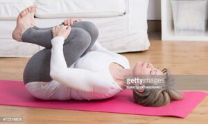 mature woman practicing pilates