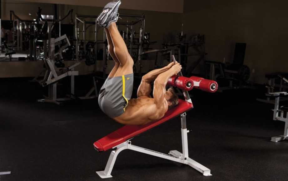weightlifter doing abs workout on a bench