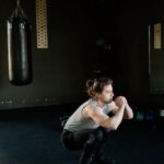 a woman squatting in a gym